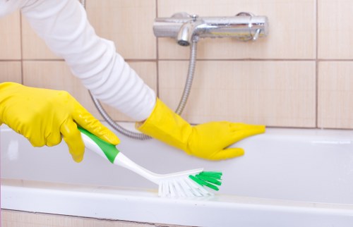 Cleaner checking cleaning products and handling them correctly
