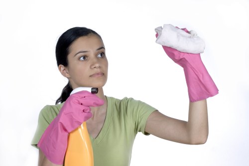 Professional cleaner confirming a service booking